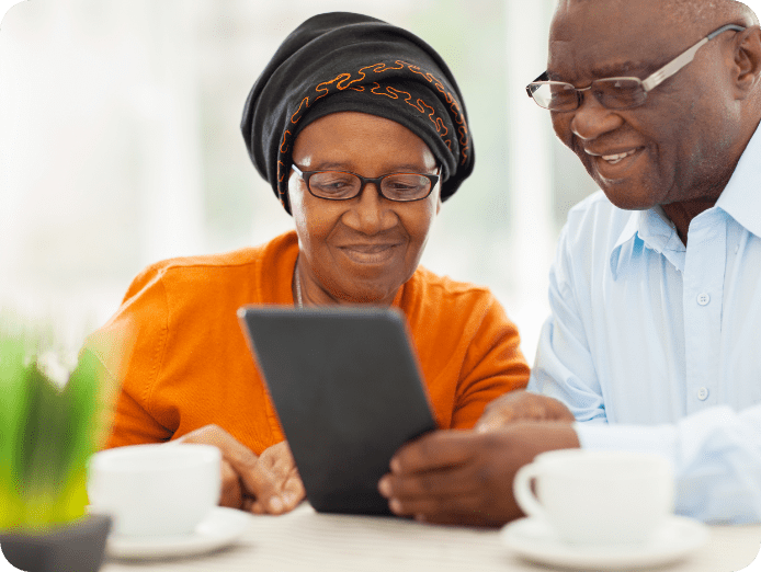 elderly couple on tablet