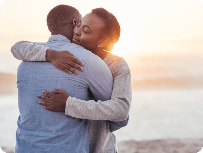 Couple hugging during sunset at the shore- CIC Insurance